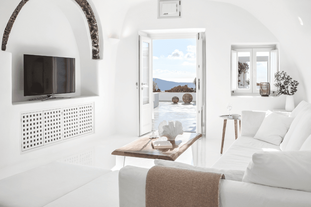 Bright living room with caldera view at Erossea Villa in Santorini