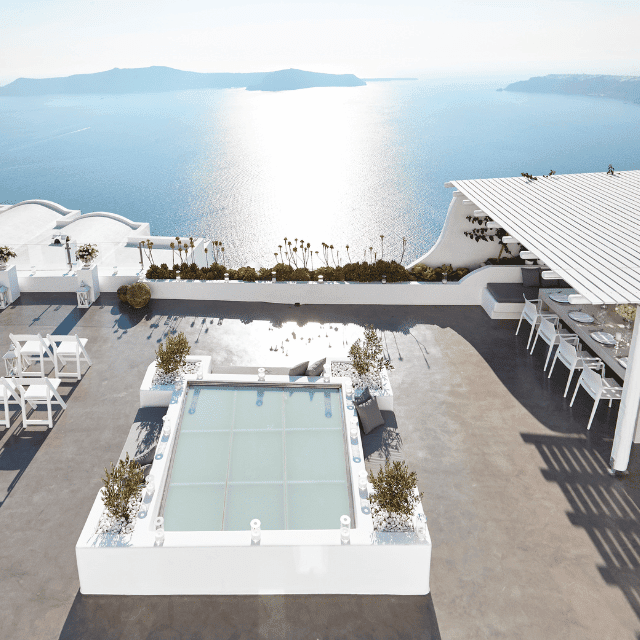 Elegant poolside patio at Erossea Villa, overlooking the serene ocean, ideal for a luxurious wedding celebration in Santorini